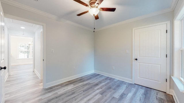 9716 Campbellsville Rd, Pulaski, TN 38478 - unfurnished room featuring attic access, ceiling fan, light wood-type flooring, crown molding, and baseboards