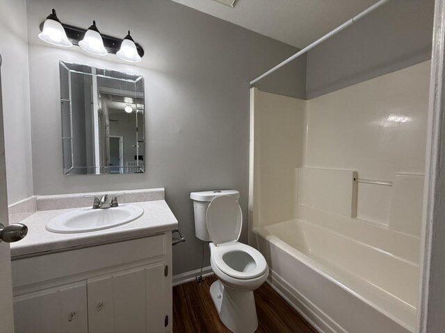 4725 Greystone St, Antioch, TN 37013 - bathroom featuring vanity, toilet, shower / washtub combination, wood finished floors, and baseboards