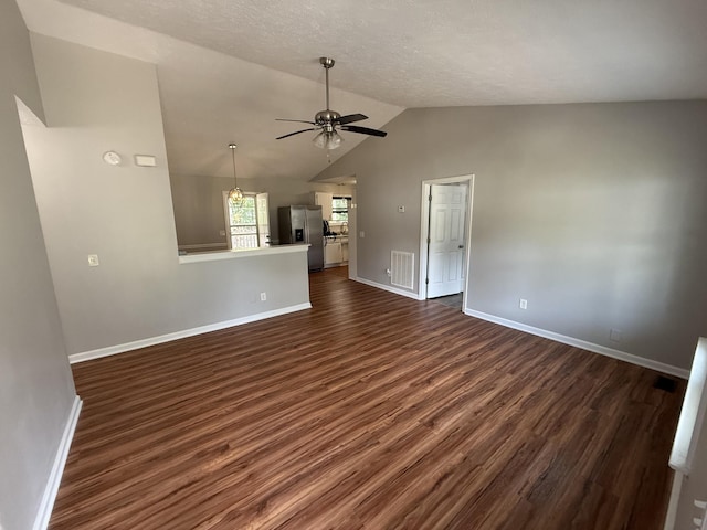 4725 Greystone St, Antioch, TN 37013 - unfurnished living room with ceiling fan, dark wood-style floors, vaulted ceiling, and baseboards