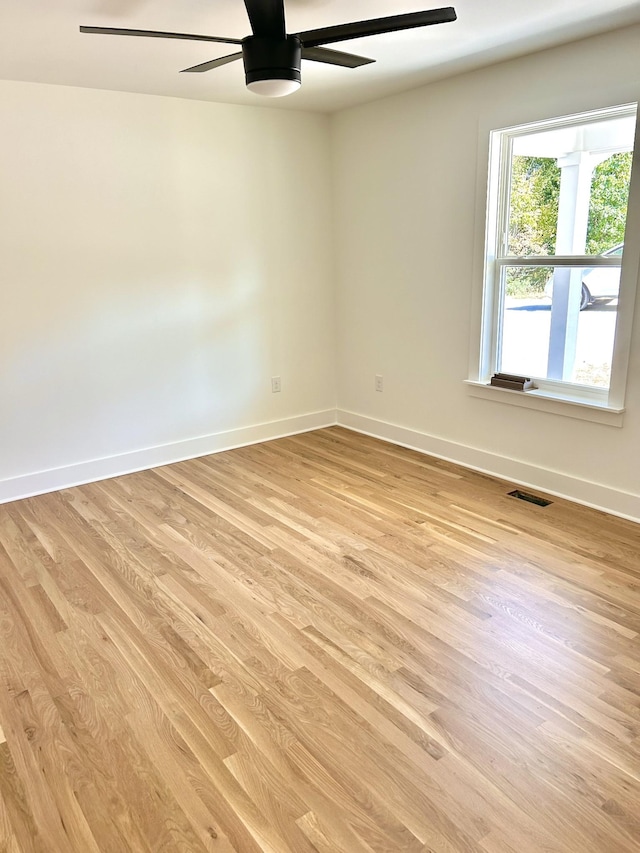 9710 Campbellsville Rd, Pulaski, TN 38478 - empty room featuring ceiling fan, light wood-style floors, and baseboards