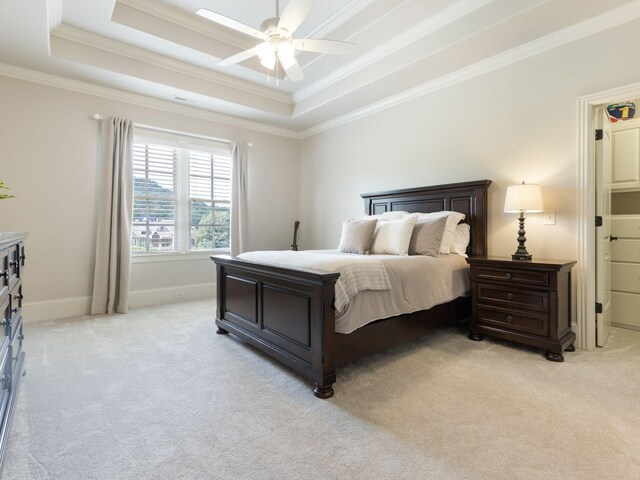 5007 Buds Farm Ln, Franklin, TN 37064 - bedroom featuring a tray ceiling, light carpet, ornamental molding, ceiling fan, and baseboards