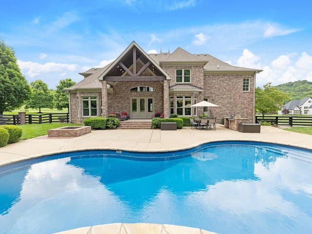 5007 Buds Farm Ln, Franklin, TN 37064 - view of swimming pool with french doors and a patio