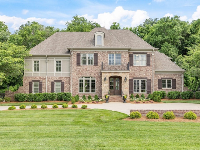 5007 Buds Farm Ln, Franklin, TN 37064 - colonial home with a front lawn, french doors, brick siding, and roof with shingles
