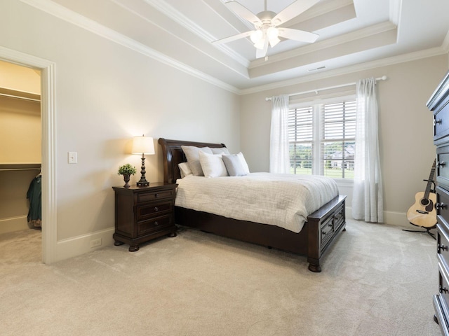 5007 Buds Farm Ln, Franklin, TN 37064 - bedroom featuring a walk in closet, a raised ceiling, light colored carpet, ornamental molding, and baseboards