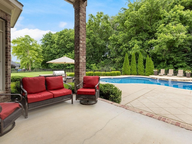 5007 Buds Farm Ln, Franklin, TN 37064 - swimming pool with a patio, view of wooded area, and an outdoor hangout area
