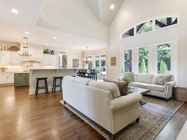 5007 Buds Farm Ln, Franklin, TN 37064 - living room with a chandelier, dark wood-type flooring, recessed lighting, ornamental molding, and high vaulted ceiling