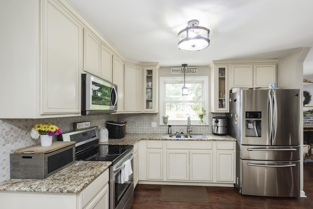 102 Ryburn Dr, Old Hickory, TN 37138 - kitchen with stainless steel appliances, a sink, backsplash, and light stone countertops