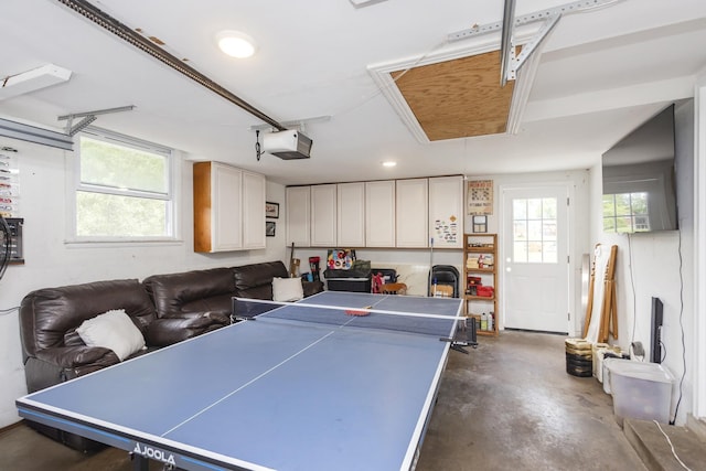 102 Ryburn Dr, Old Hickory, TN 37138 - recreation room featuring concrete flooring, attic access, plenty of natural light, and a garage