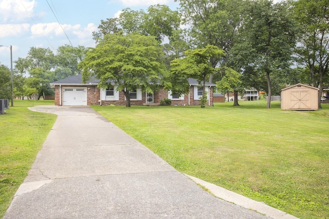 102 Ryburn Dr, Old Hickory, TN 37138 - obstructed view of property featuring an attached garage, driveway, and a front yard