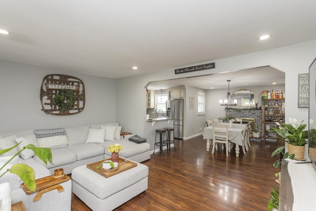 102 Ryburn Dr, Old Hickory, TN 37138 - living room with arched walkways, recessed lighting, dark wood-style flooring, a chandelier, and baseboards