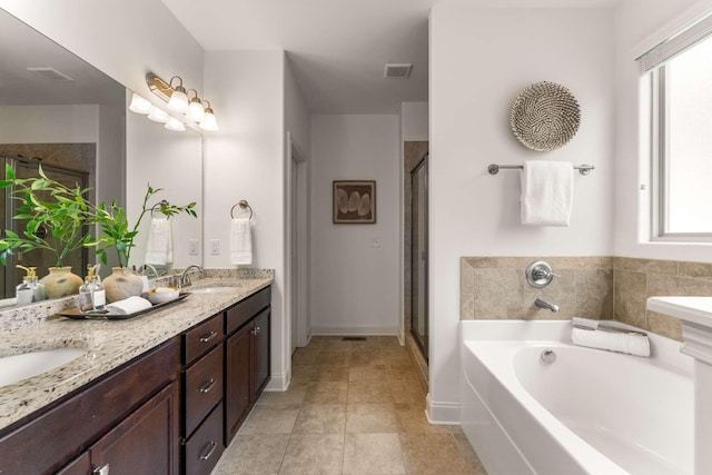 23 Hope Ct, Mount Juliet, TN 37122 - full bath featuring a garden tub, double vanity, a shower stall, and plenty of natural light