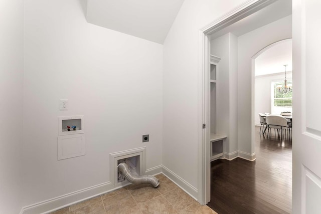 23 Hope Ct, Mount Juliet, TN 37122 - laundry room with hookup for an electric dryer, hookup for a washing machine, a chandelier, baseboards, and arched walkways