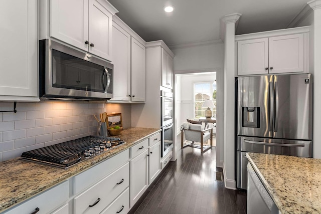 23 Hope Ct, Mount Juliet, TN 37122 - kitchen with appliances with stainless steel finishes, white cabinets, decorative backsplash, light stone countertops, and ornamental molding