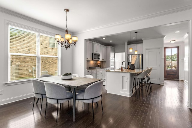 23 Hope Ct, Mount Juliet, TN 37122 - dining space with a chandelier, dark wood-type flooring, crown molding, and baseboards