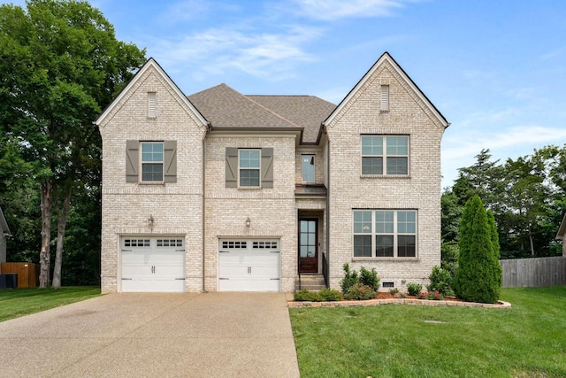 23 Hope Ct, Mount Juliet, TN 37122 - view of front facade with driveway, a garage, brick siding, cooling unit, and roof with shingles