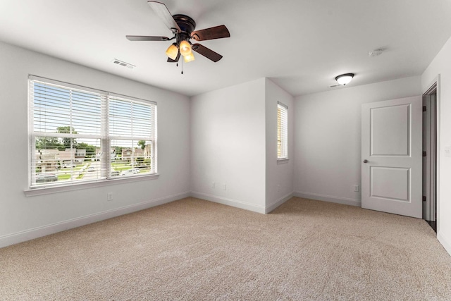 23 Hope Ct, Mount Juliet, TN 37122 - unfurnished room featuring plenty of natural light, a ceiling fan, light carpet, and baseboards