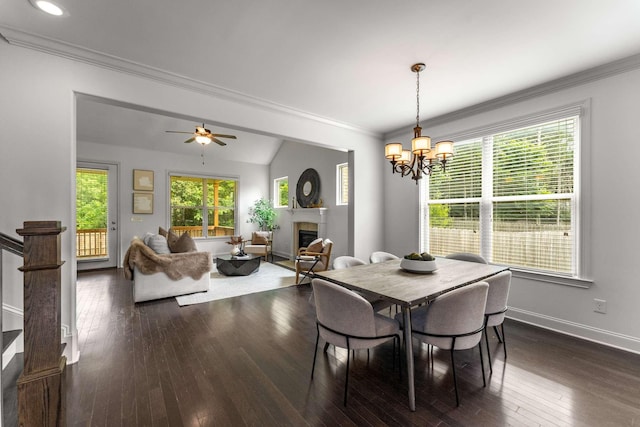 23 Hope Ct, Mount Juliet, TN 37122 - dining area featuring a fireplace, baseboards, dark wood-style floors, crown molding, and a chandelier