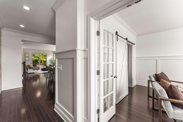 23 Hope Ct, Mount Juliet, TN 37122 - corridor with ornamental molding, a barn door, wainscoting, dark wood finished floors, and a decorative wall