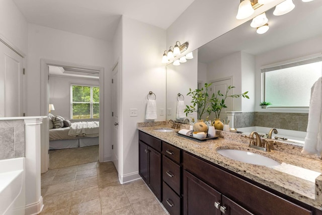 23 Hope Ct, Mount Juliet, TN 37122 - full bathroom featuring double vanity, a bath, ensuite bath, and baseboards