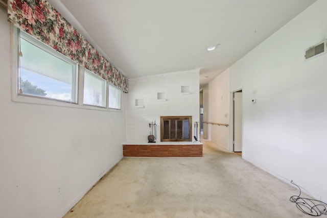 929 Deervale Dr, Nashville, TN 37217 - unfurnished living room with carpet, a glass covered fireplace, and lofted ceiling
