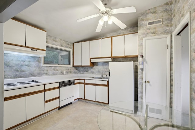 929 Deervale Dr, Nashville, TN 37217 - kitchen featuring lofted ceiling, white appliances, under cabinet range hood, light countertops, and white cabinets