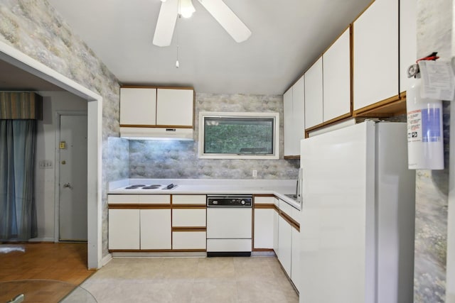 929 Deervale Dr, Nashville, TN 37217 - kitchen with white appliances, under cabinet range hood, ceiling fan, light countertops, and white cabinets