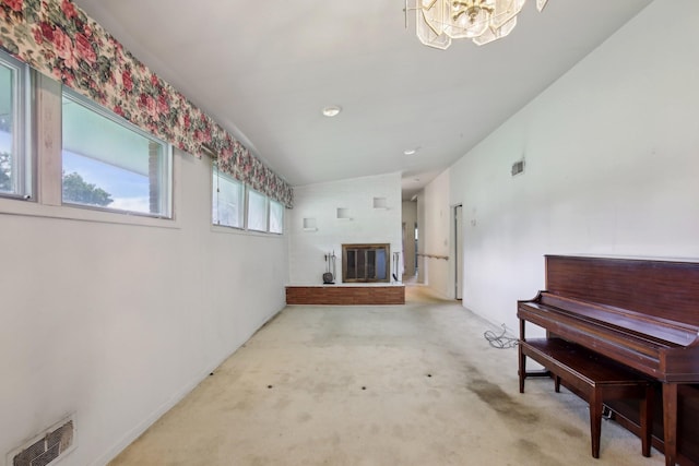 929 Deervale Dr, Nashville, TN 37217 - carpeted living room featuring a chandelier and a glass covered fireplace