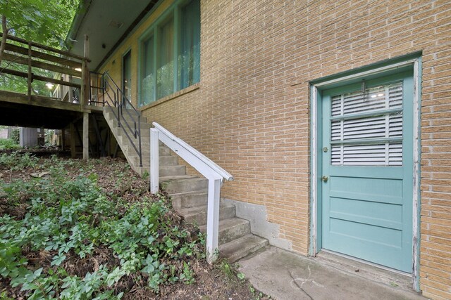 929 Deervale Dr, Nashville, TN 37217 - view of exterior entry with brick siding and a wooden deck