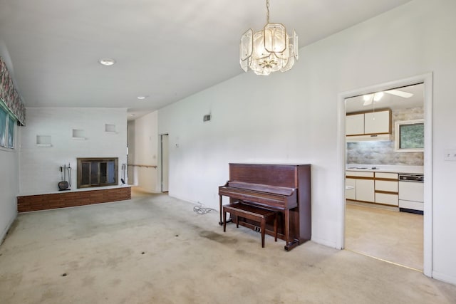 929 Deervale Dr, Nashville, TN 37217 - living area featuring light carpet, a chandelier, a glass covered fireplace, and a ceiling fan