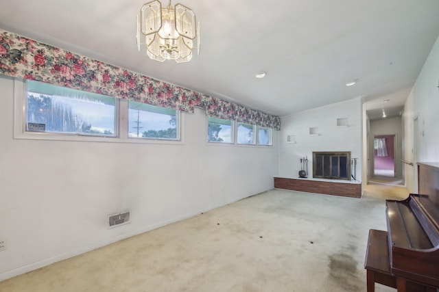929 Deervale Dr, Nashville, TN 37217 - unfurnished living room with carpet flooring, a chandelier, baseboards, and a glass covered fireplace