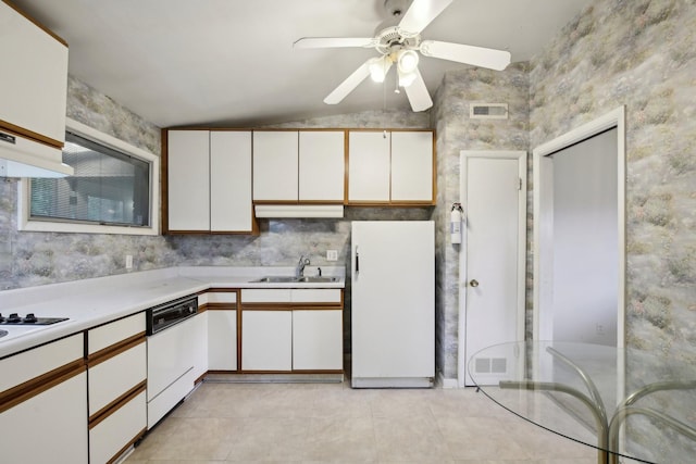 929 Deervale Dr, Nashville, TN 37217 - kitchen with white appliances, light countertops, white cabinetry, vaulted ceiling, and ceiling fan