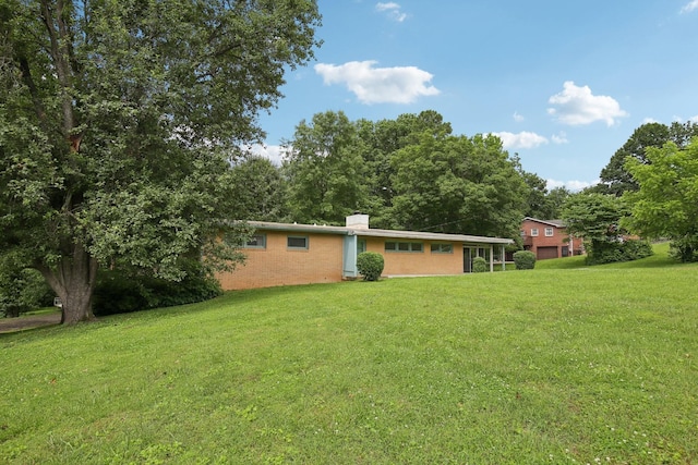 929 Deervale Dr, Nashville, TN 37217 - back of house with a yard and a chimney