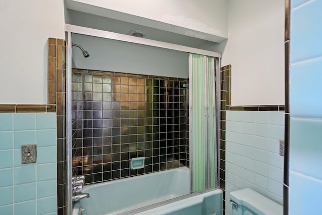 929 Deervale Dr, Nashville, TN 37217 - full bathroom featuring tile walls, shower / bath combo, toilet, and a wainscoted wall