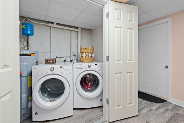 7214 Timberlane Dr, Fairview, TN 37062 - laundry room with washing machine and dryer, light wood-style floors, and water heater