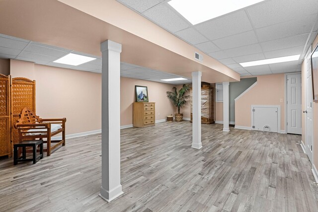 7214 Timberlane Dr, Fairview, TN 37062 - finished basement with a paneled ceiling, light wood-type flooring, and baseboards