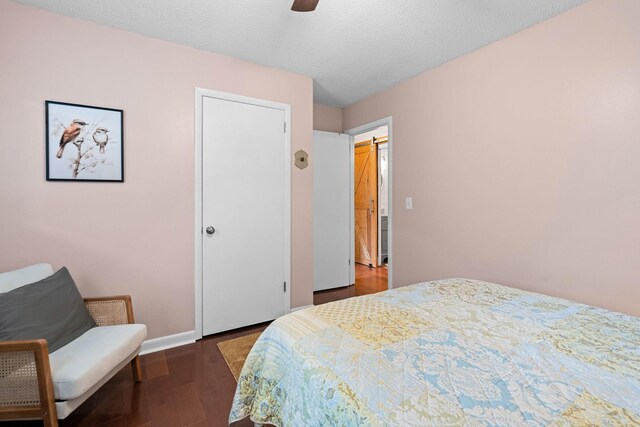 7214 Timberlane Dr, Fairview, TN 37062 - bedroom featuring wood finished floors, baseboards, a ceiling fan, and a textured ceiling