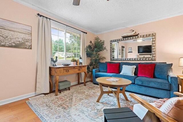 7214 Timberlane Dr, Fairview, TN 37062 - living area featuring a ceiling fan, ornamental molding, a textured ceiling, baseboards, and wood finished floors