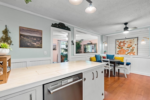 7214 Timberlane Dr, Fairview, TN 37062 - kitchen featuring stainless steel dishwasher, ceiling fan, tile counters, a textured ceiling, and light wood-style floors