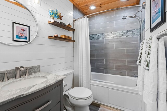 7214 Timberlane Dr, Fairview, TN 37062 - full bathroom featuring shower / tub combo, vanity, toilet, recessed lighting, and wood walls