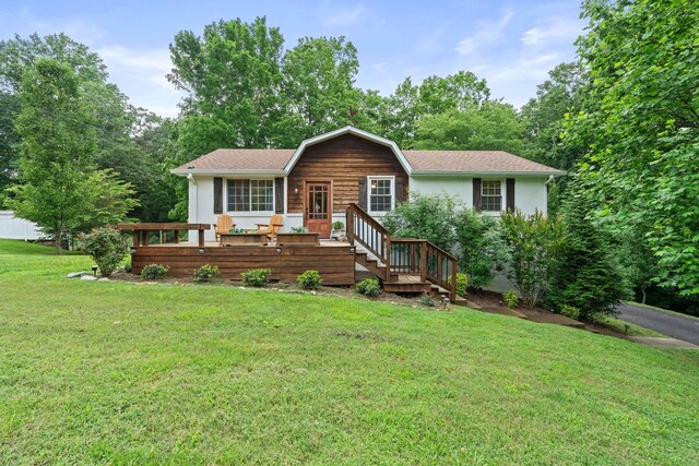 7214 Timberlane Dr, Fairview, TN 37062 - view of front of house with a front yard, a deck, and a shingled roof