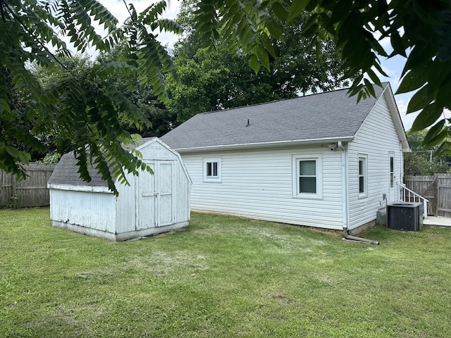 506 Garden St, Mount Pleasant, TN 38474 - rear view of house with roof with shingles and central air condition unit