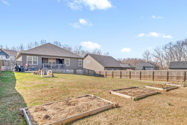 2913 Feng Way, Clarksville, TN 37040 - back of house featuring a garden and roof with shingles