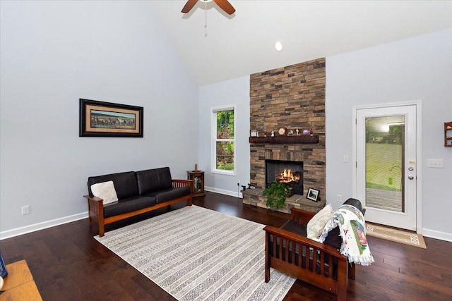 1047 Caballo Trl, Gallatin, TN 37066 - living room featuring baseboards, a stone fireplace, a ceiling fan, high vaulted ceiling, and wood finished floors