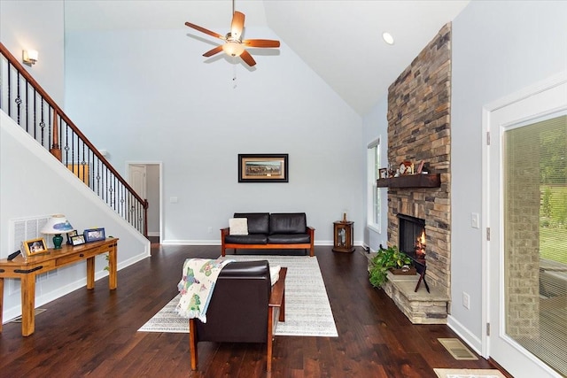 1047 Caballo Trl, Gallatin, TN 37066 - living room with high vaulted ceiling, stairs, a ceiling fan, wood finished floors, and a fireplace