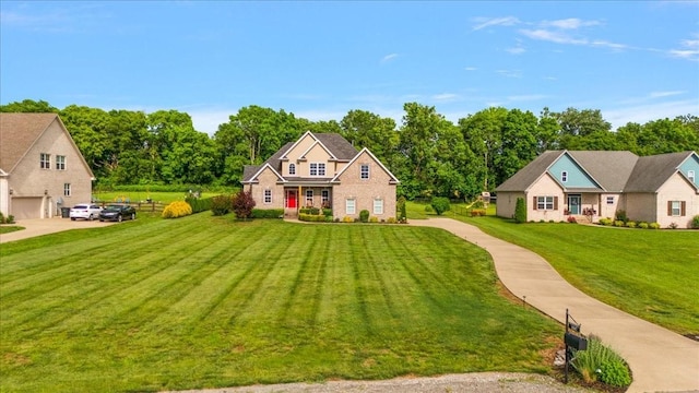 1047 Caballo Trl, Gallatin, TN 37066 - view of front of house featuring a front yard, brick siding, and driveway