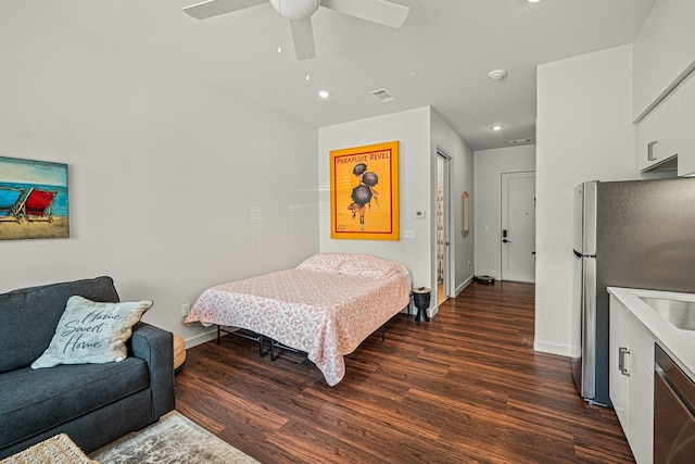 1014 16th Ave S Unit 210, Nashville, TN 37212 - bedroom with freestanding refrigerator, dark wood-style floors, baseboards, recessed lighting, and a ceiling fan