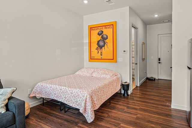 1014 16th Ave S Unit 210, Nashville, TN 37212 - bedroom with wood finished floors, baseboards, and recessed lighting
