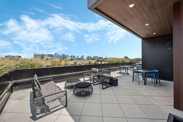 1014 16th Ave S Unit 210, Nashville, TN 37212 - view of patio with a view of city, outdoor dining space, and an outdoor fire pit
