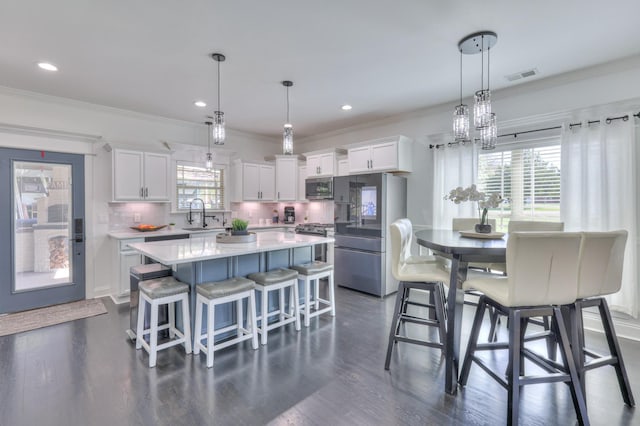 831 W Sagefield Dr, Smyrna, TN 37167 - dining space featuring ornamental molding, dark wood finished floors, recessed lighting, and a chandelier