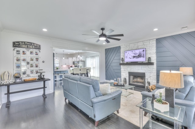 831 W Sagefield Dr, Smyrna, TN 37167 - living room featuring ornamental molding, a ceiling fan, wood finished floors, a fireplace, and recessed lighting